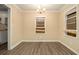 Dining room featuring wood-look floors, chandelier, and windows at 1907 Oak Valley Rd, Decatur, GA 30035