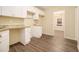 Functional kitchen with white cabinets, countertops, and modern flooring at 1907 Oak Valley Rd, Decatur, GA 30035