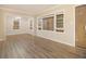 Inviting living room showcases wood-look floors and natural light from boarded windows at 1907 Oak Valley Rd, Decatur, GA 30035