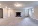 Spacious basement featuring a brick fireplace, neutral paint colors, and access to the exterior at 1956 Joseph Ct, Decatur, GA 30032
