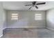Bedroom with neutral paint, gray carpet, ceiling fan, and natural light from windows at 1956 Joseph Ct, Decatur, GA 30032