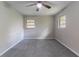 Bedroom with neutral paint, gray carpet, ceiling fan, and natural light from windows at 1956 Joseph Ct, Decatur, GA 30032