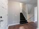 Entryway with dark stained stairs, wood flooring, and white painted trim at 1956 Joseph Ct, Decatur, GA 30032