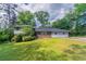 Charming single-Gathering home features a brick facade, well-maintained lawn, and lush landscaping at 1956 Joseph Ct, Decatur, GA 30032