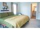 Inviting bedroom with neutral carpet and ensuite bathroom at 284 Bryson Lake Cir, Douglasville, GA 30134