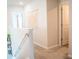 Bright hallway featuring modern decor and neutral carpet at 284 Bryson Lake Cir, Douglasville, GA 30134