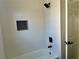 Clean bathroom with white tiled shower and dark fixtures at 4192 Medlock River Ct, Snellville, GA 30039