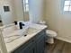 Bathroom vanity with white countertop and modern fixtures at 4192 Medlock River Ct, Snellville, GA 30039
