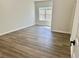 Bedroom featuring hardwood floors and a window providing natural light at 4192 Medlock River Ct, Snellville, GA 30039