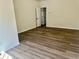 Bedroom with modern flooring and neutral walls with a door to another room at 4192 Medlock River Ct, Snellville, GA 30039