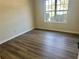 Bedroom featuring hardwood floors and window at 4192 Medlock River Ct, Snellville, GA 30039
