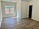 Bedroom featuring hardwood floors, window, and ample space at 4192 Medlock River Ct, Snellville, GA 30039