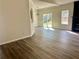 Dining room featuring hardwood floors, chair rail, and view to the backyard at 4192 Medlock River Ct, Snellville, GA 30039