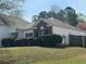 Charming home with brick and siding, manicured bushes, and well-maintained lawn at 4192 Medlock River Ct, Snellville, GA 30039