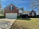 Charming two-story home featuring a brick facade and a well-maintained front yard at 4192 Medlock River Ct, Snellville, GA 30039