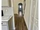 Hallway featuring archway and luxury vinyl plank flooring at 4192 Medlock River Ct, Snellville, GA 30039