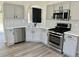 Modern kitchen with stainless steel appliances, marble countertops and subway tile backsplash at 4192 Medlock River Ct, Snellville, GA 30039