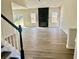 Spacious living room boasting new floors, fireplace, natural light, and neutral wall colors at 4192 Medlock River Ct, Snellville, GA 30039