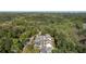 Aerial view showcasing a neighborhood surrounded by lush greenery with the city skyline in the distance at 1720 Barclay Close Nw, Atlanta, GA 30318