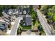Aerial view of a home showing mature trees, green lawn, and well manicured landscaping at 1720 Barclay Close Nw, Atlanta, GA 30318