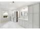 Bright bathroom with double vanities, marble floors, and modern fixtures at 1720 Barclay Close Nw, Atlanta, GA 30318