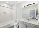 Bathroom featuring white subway tile in the shower, gray tile floors, and white cabinets at 1720 Barclay Close Nw, Atlanta, GA 30318