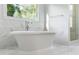 Luxurious bathroom featuring a soaking tub and glass shower at 1720 Barclay Close Nw, Atlanta, GA 30318