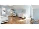 Bright Bedroom features hardwood floors, crisp white trim, white furniture, and natural light at 1720 Barclay Close Nw, Atlanta, GA 30318