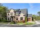 Beautiful two-story brick home with a well-manicured lawn and attached two car garage at 1720 Barclay Close Nw, Atlanta, GA 30318