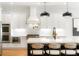 Modern kitchen featuring white cabinets, stainless steel appliances, and a large island at 1720 Barclay Close Nw, Atlanta, GA 30318