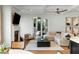 Relaxing living room with fireplace, hardwood floors, neutral walls, comfortable sofa, and lots of light from patio doors at 1720 Barclay Close Nw, Atlanta, GA 30318