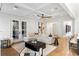Elegant living room with coffered ceilings, French doors, and stylish decor at 1720 Barclay Close Nw, Atlanta, GA 30318