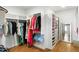 Organized walk-in closet with custom shelving and ample storage space at 1720 Barclay Close Nw, Atlanta, GA 30318