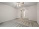 A carpeted bedroom features a closet and bathroom access at 1923 Brian Way # 1923, Decatur, GA 30033