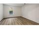 Spacious bedroom with a window, light colored walls and wood-look laminate flooring at 1923 Brian Way # 1923, Decatur, GA 30033