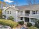 Condominium exterior with manicured landscaping and stairs leading to upper level units at 1923 Brian Way # 1923, Decatur, GA 30033