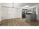Open kitchen with stainless steel appliances and stylish grey cabinets at 1923 Brian Way # 1923, Decatur, GA 30033