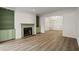 Inviting living room with a fireplace and built-in cabinets, featuring new flooring at 1923 Brian Way # 1923, Decatur, GA 30033