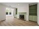 Bright living room showcases a fireplace with built-in shelving and large windows at 1923 Brian Way # 1923, Decatur, GA 30033