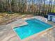 Aerial view of community pool surrounded by lush trees and a fence at 1923 Brian Way # 1923, Decatur, GA 30033