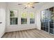 Bright sunroom with many windows and new flooring, offering a relaxing space at 1923 Brian Way # 1923, Decatur, GA 30033
