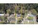 Aerial view of a property with a yellow boundary line, showcasing the home, surrounding trees, and neighborhood at 3340 Brenda Ln, Lithia Springs, GA 30122