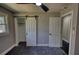Bedroom with a sliding barn door closet and a modern ceiling fan at 3340 Brenda Ln, Lithia Springs, GA 30122