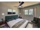Neutral bedroom boasting two bedside tables, a large bed, and a window view at 3340 Brenda Ln, Lithia Springs, GA 30122