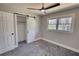 Bedroom featuring a window with views and a closet with barn door at 3340 Brenda Ln, Lithia Springs, GA 30122