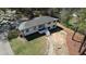 Charming two-story home with a walkway leading to a bright blue door, surrounded by mature trees and a well-kept lawn at 3340 Brenda Ln, Lithia Springs, GA 30122