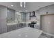 Gray kitchen boasts stainless appliances, stone countertops, and ample cabinet space at 3340 Brenda Ln, Lithia Springs, GA 30122