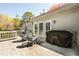 Spacious back deck with outdoor seating, a dining table, and a Blackstone grill, perfect for entertaining at 3897 Beacon St, Marietta, GA 30062