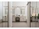 A well-lit bathroom featuring a double vanity, a makeup vanity, a soaking tub, and a private toilet at 3897 Beacon St, Marietta, GA 30062