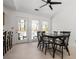 Bright dining room features a table for six, white walls, and a door that leads to the deck at 3897 Beacon St, Marietta, GA 30062